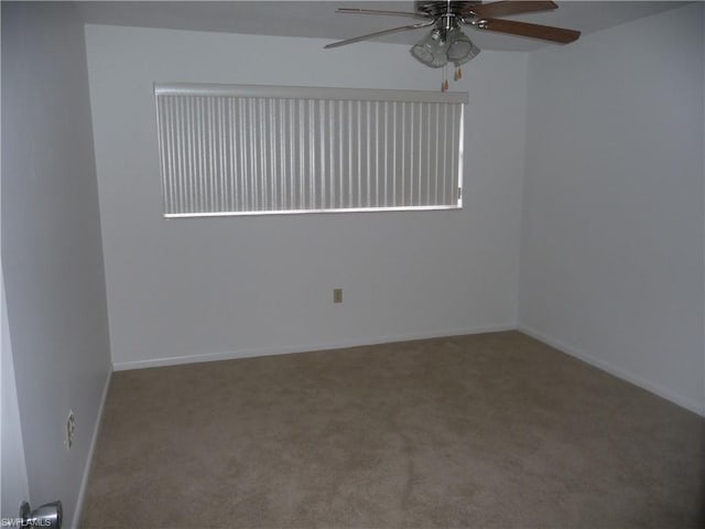 carpeted empty room with ceiling fan