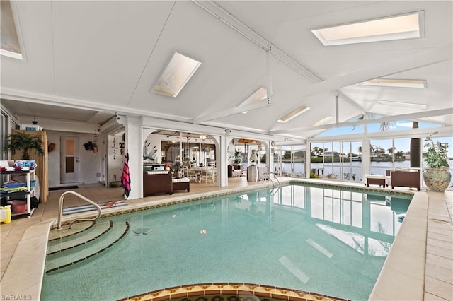 view of swimming pool with a skylight