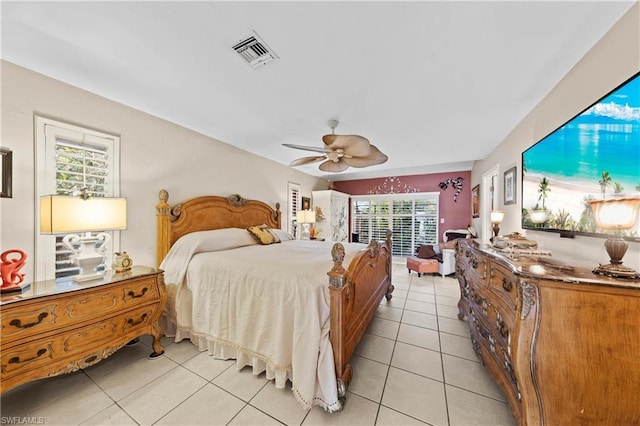 bedroom featuring ceiling fan and light tile floors