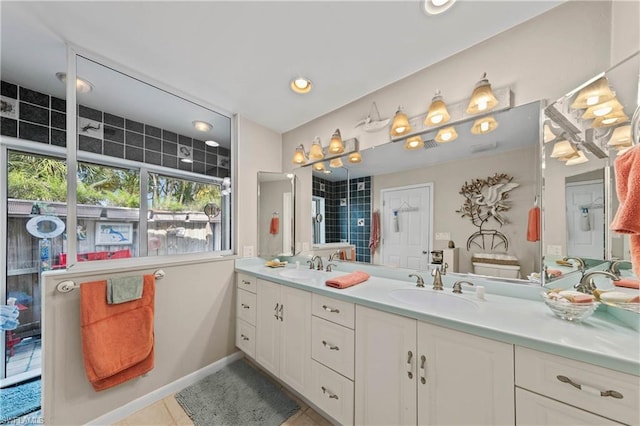 bathroom with tile flooring, double sink, and oversized vanity