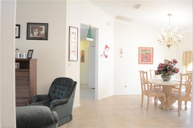 dining area with a notable chandelier and light tile flooring