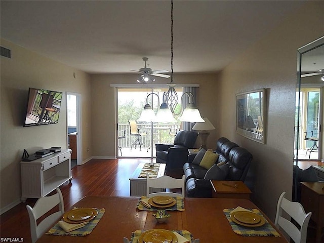 dining space with dark hardwood / wood-style floors and ceiling fan