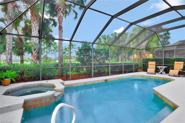 view of pool featuring an in ground hot tub and a lanai