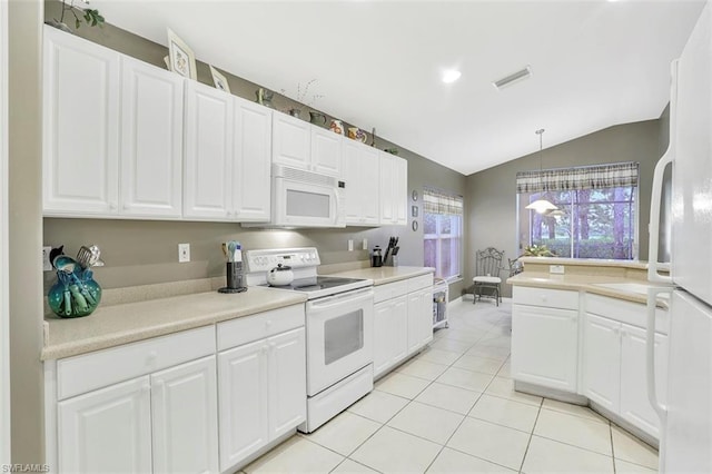 kitchen featuring white appliances, decorative light fixtures, vaulted ceiling, and white cabinetry