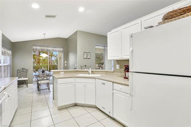 kitchen featuring white cabinets, hanging light fixtures, white appliances, and sink