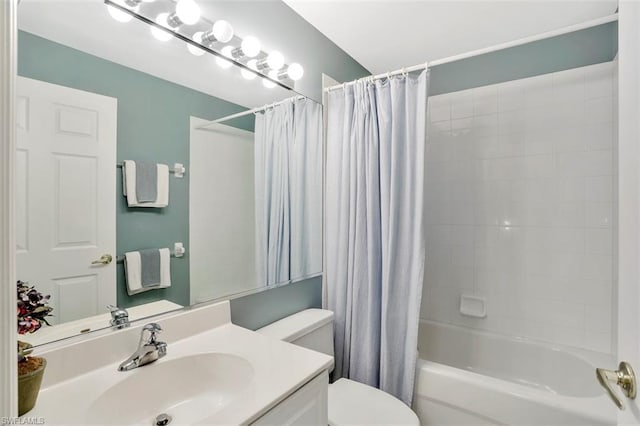 full bathroom featuring toilet, shower / bath combo, and vanity