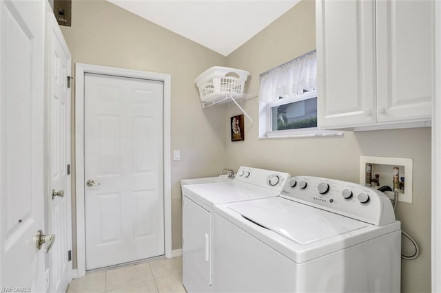 laundry area with sink, hookup for a washing machine, light tile flooring, cabinets, and washing machine and dryer