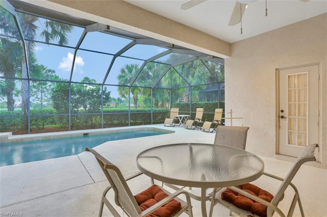 view of pool featuring a jacuzzi and ceiling fan