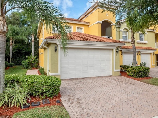 mediterranean / spanish-style home featuring a garage