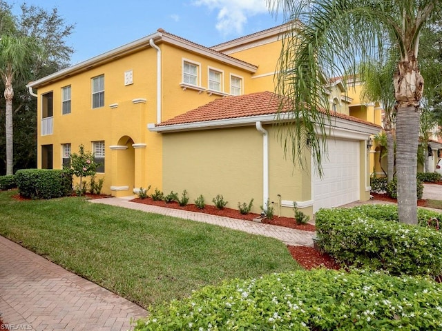 mediterranean / spanish-style home with a front lawn