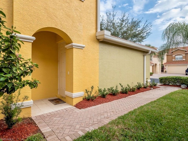 exterior space with a lawn and a garage