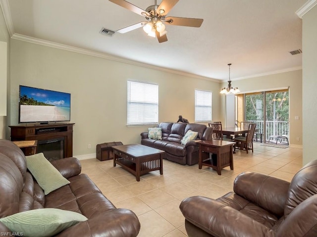 tiled living room featuring crown molding and ceiling fan with notable chandelier