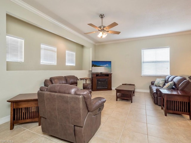 tiled living room featuring crown molding and ceiling fan