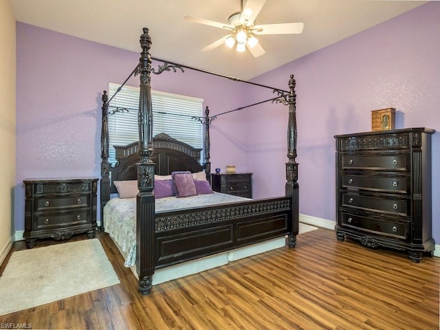 bedroom with wood-type flooring and ceiling fan