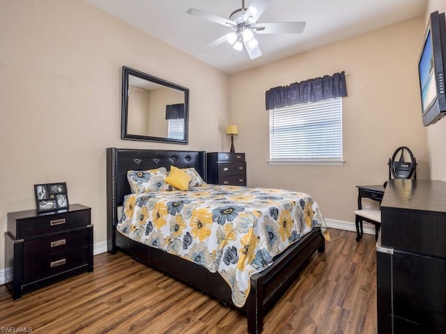 bedroom with ceiling fan and wood-type flooring