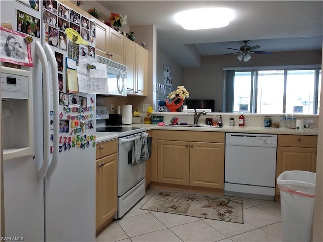 kitchen with ceiling fan, white appliances, sink, light tile floors, and light brown cabinetry