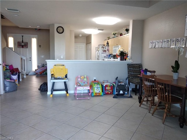 playroom with light tile floors