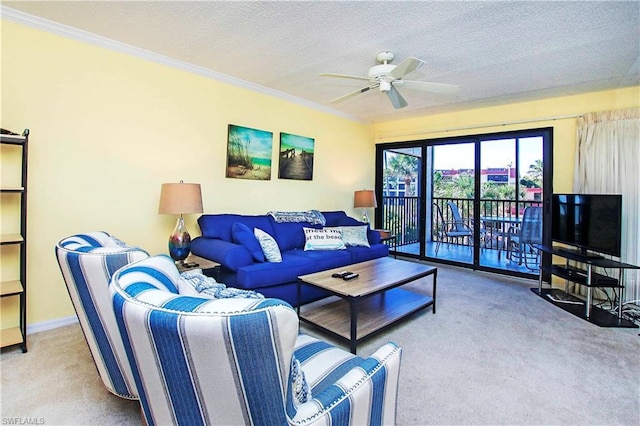 carpeted living room featuring a textured ceiling, ceiling fan, and ornamental molding