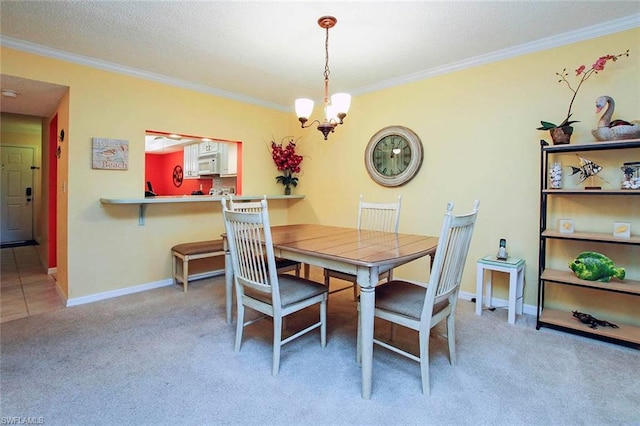 dining area featuring light carpet, a notable chandelier, a textured ceiling, and crown molding