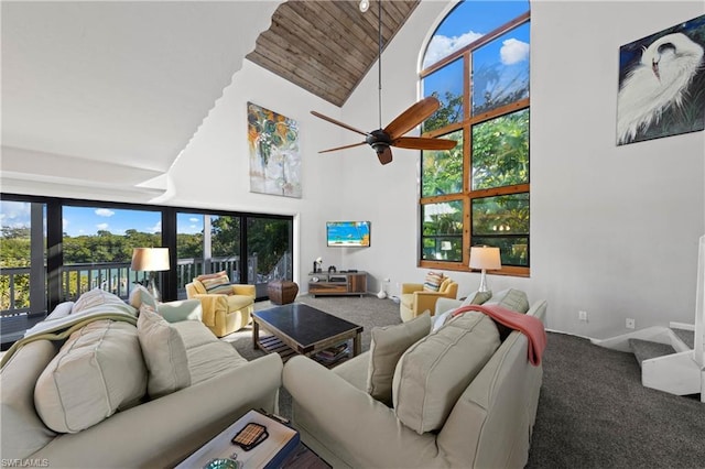 living room featuring carpet flooring, high vaulted ceiling, and ceiling fan