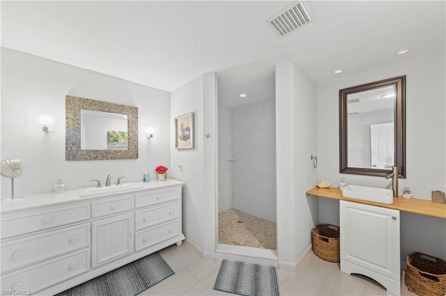 bathroom with tile floors and vanity