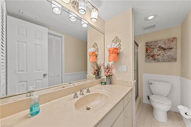 bathroom with oversized vanity, toilet, and tile flooring