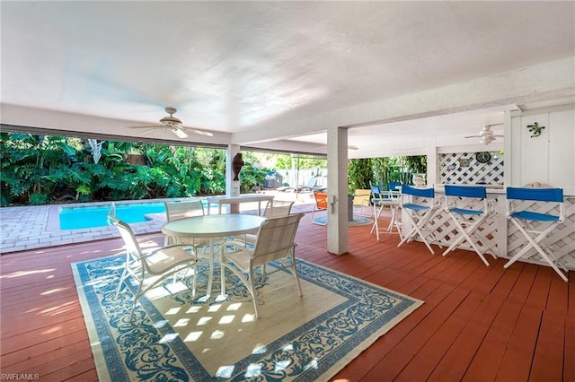 wooden deck featuring ceiling fan