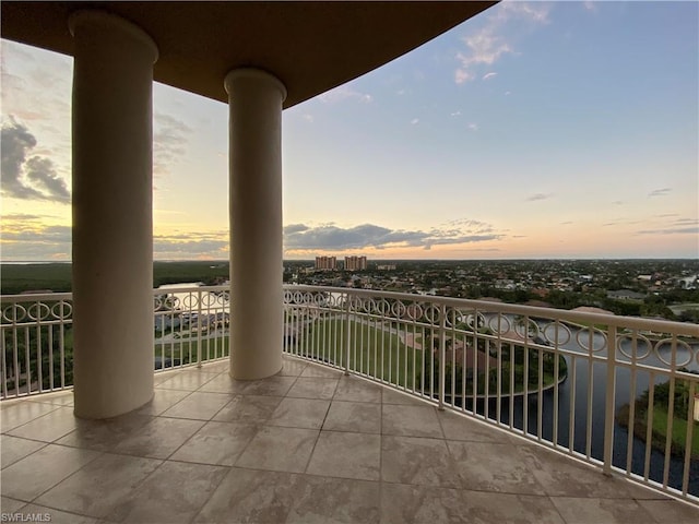 view of balcony at dusk