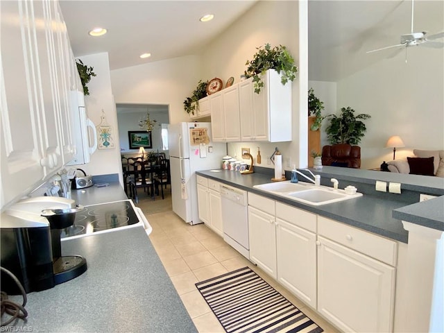 kitchen with light tile floors, ceiling fan with notable chandelier, white appliances, white cabinets, and sink