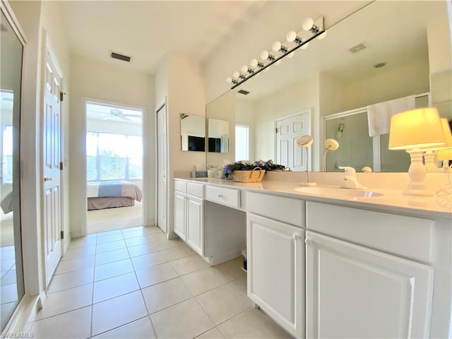 bathroom with vanity and tile flooring