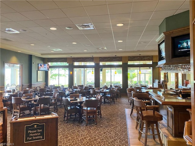 dining room with a paneled ceiling