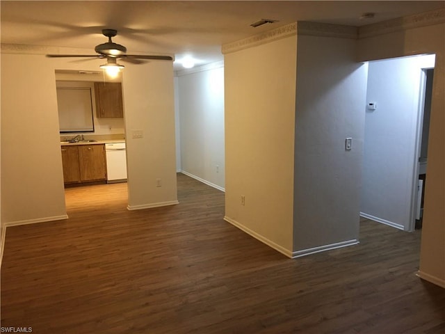 interior space featuring ceiling fan, dark hardwood / wood-style floors, and sink