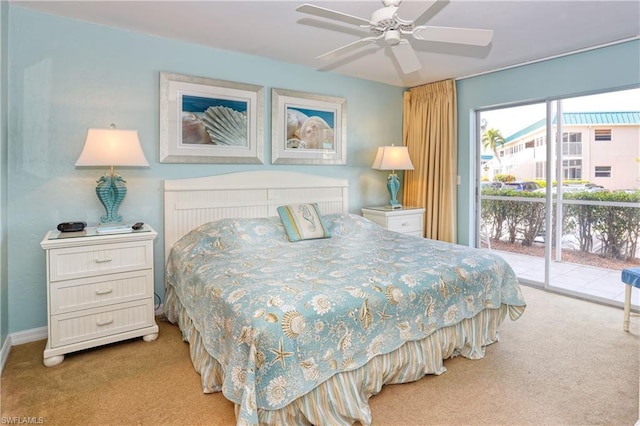 bedroom featuring access to outside, light carpet, and ceiling fan