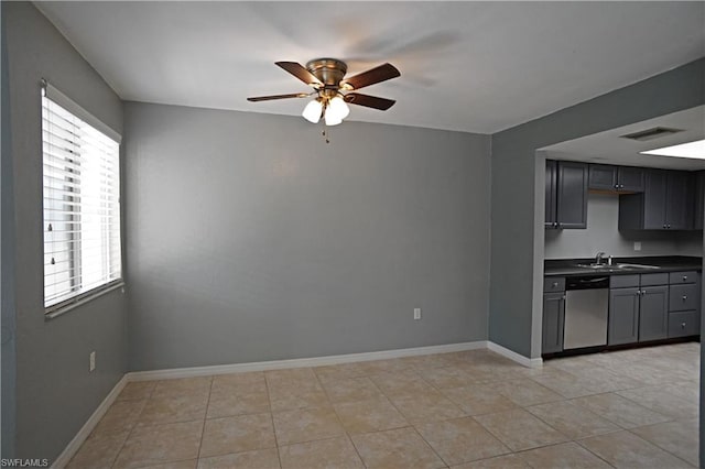 interior space featuring gray cabinetry, ceiling fan, dishwasher, and light tile floors