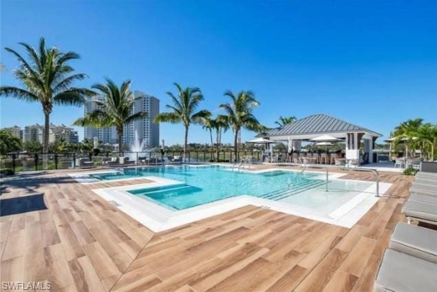 view of pool featuring a gazebo, a hot tub, and a patio area