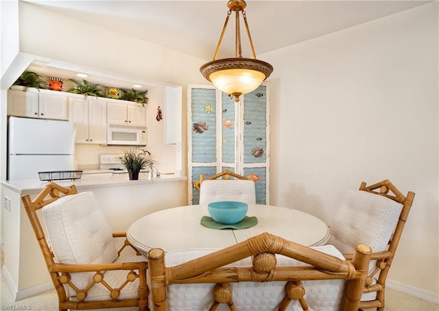 dining area with light carpet