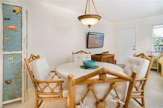 view of carpeted dining area