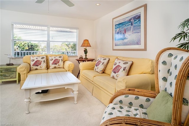 living room with light colored carpet and ceiling fan