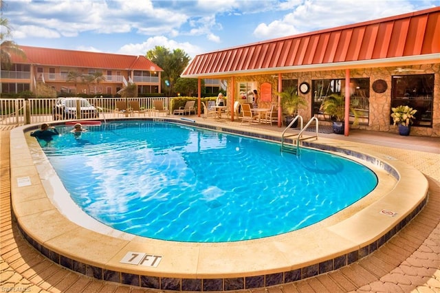 view of swimming pool featuring a patio