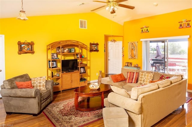 living room featuring vaulted ceiling, ceiling fan, and hardwood / wood-style flooring