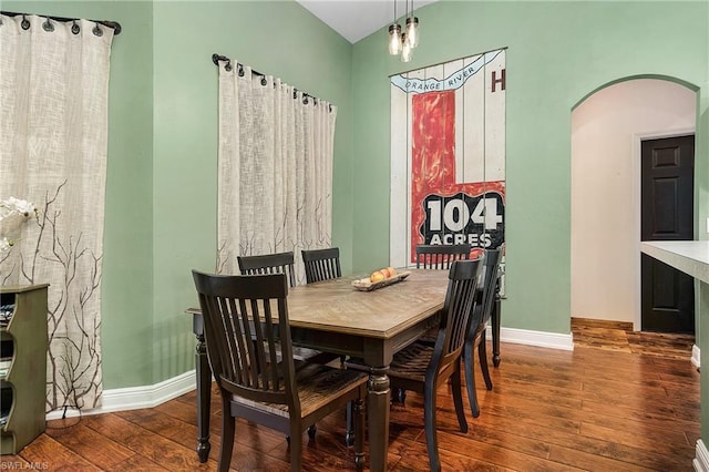 dining room with a chandelier and dark hardwood / wood-style flooring