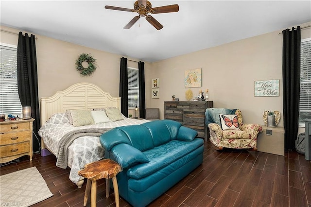 bedroom with ceiling fan and dark hardwood / wood-style flooring