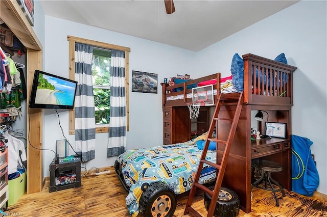 bedroom featuring hardwood / wood-style floors and ceiling fan