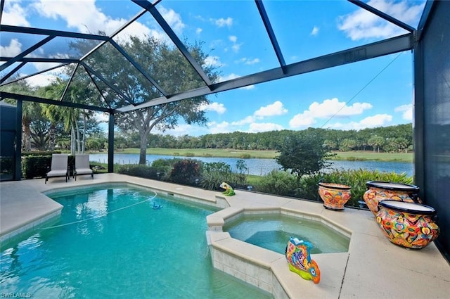 view of pool with an in ground hot tub, a lanai, and a patio