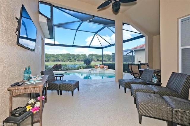 sunroom featuring ceiling fan