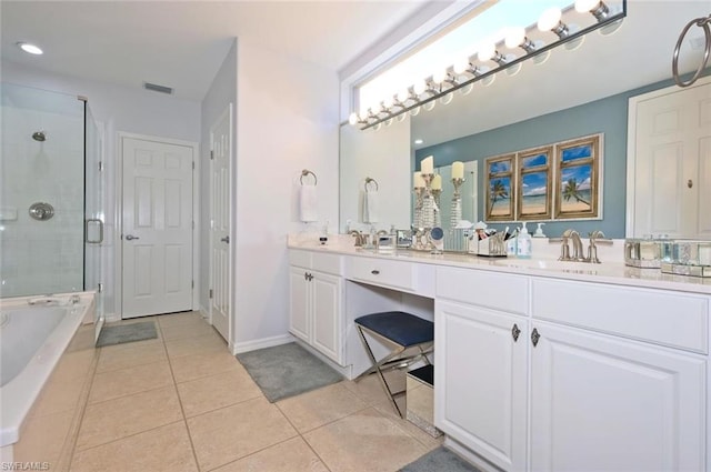 bathroom with tile flooring, independent shower and bath, large vanity, and dual sinks