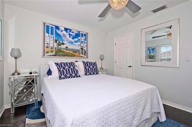 bedroom featuring dark hardwood / wood-style floors and ceiling fan