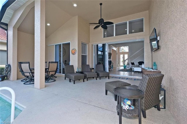 view of patio featuring ceiling fan