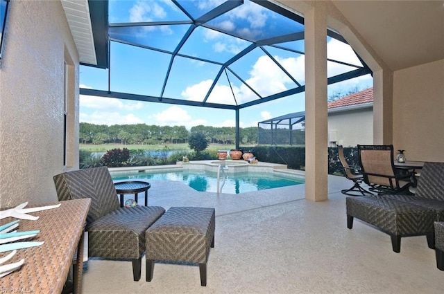 view of swimming pool featuring a patio area and glass enclosure