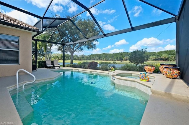 view of pool featuring an in ground hot tub, a patio, and a lanai